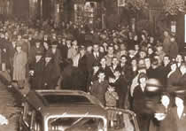 Photograph of a crowd of people in a cinema queue