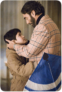Still image from The Kite Runner, Amir and his father embrace