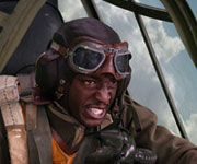 A still from the film Red Tails of a black pilot in the cockpit of a plane