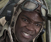 A still from the film Red Tails of a black pilot in the cockpit of a plane