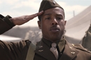 A young black World War II soldier saluting