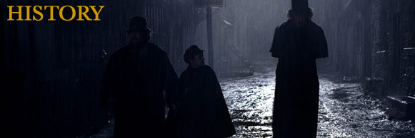 History title graphic - 3 characters in silhouette, walking down a rainy street