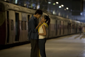 Lead characters Latika and Jamal in an embrace at VT station